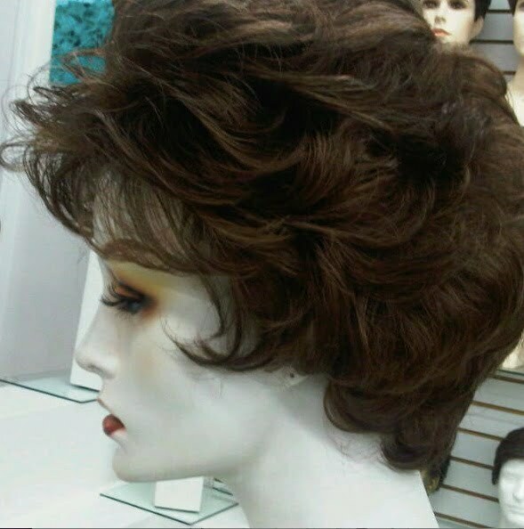 The side of a short wavy wig on a mannequin